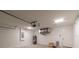 Bright garage interior, featuring modern utilities, an access door, and ample storage space ready for customization at 1 Pine Trace Trl, Ocala, FL 34472