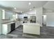 Modern kitchen featuring white cabinets, quartz countertops, and stainless steel appliances at 1 Pine Trace Trl, Ocala, FL 34472