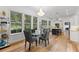 Bright dining area with hardwood floors and a glass table at 2291 Sw 76Th Ln, Ocala, FL 34476