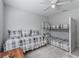 Bedroom featuring bunkbeds, queen sized bed and gray carpeting at 11831 Sw Highway 484, Dunnellon, FL 34432