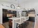 Well-lit kitchen with black cabinets, stainless steel appliances, a center island, and modern pendant lighting at 11831 Sw Highway 484, Dunnellon, FL 34432