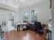 Bright office with vaulted ceilings and large arched windows overlooking the landscaped yard at 11831 Sw Highway 484, Dunnellon, FL 34432