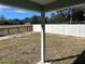 Private backyard with a white vinyl fence and open views of a rural landscape at 1696 Sw 144Th Ct, Ocala, FL 34481