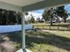 Open view of the backyard showcasing a partially visible fence and surrounding landscape at 1696 Sw 144Th Ct, Ocala, FL 34481