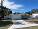 Newly constructed home with a white vinyl fence and a two-car garage at 1696 Sw 144Th Ct, Ocala, FL 34481