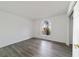 Light filled bedroom featuring a large window, and wood floors at 5110 Nw 19Th Pl, Ocala, FL 34482