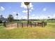 Horses in a paddock with a water sprinkler at 7137 & 7141 S Magnolia Ave, Ocala, FL 34476