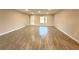 Spacious open-concept living room featuring modern tile flooring and natural light at 4872 Sw 100Th St, Ocala, FL 34476