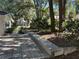 Private backyard patio with stone border and shaded trees at 8420 Sw 92Nd St # B, Ocala, FL 34481