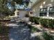 Side yard with gravel landscaping and walkway to home at 8420 Sw 92Nd St # B, Ocala, FL 34481