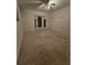 Large carpeted bedroom with a ceiling fan, bay window, and closet at 9180 Sw 202Nd Avenue Road, Dunnellon, FL 34431