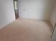 Bedroom with neutral carpet, white trim, and a door leading to the pool at 9180 Sw 202Nd Avenue Road, Dunnellon, FL 34431