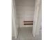 Walk-in closet with shelving and tile flooring at 9180 Sw 202Nd Avenue Road, Dunnellon, FL 34431