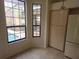 Dining area with tile flooring and many windows overlooking the pool at 9180 Sw 202Nd Avenue Road, Dunnellon, FL 34431