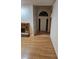 Inviting entryway featuring wood flooring, brick fireplace, and neutral walls at 9180 Sw 202Nd Avenue Road, Dunnellon, FL 34431