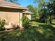 Exterior view of home with propane tank and lush landscaping at 9180 Sw 202Nd Avenue Road, Dunnellon, FL 34431