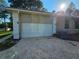 Spacious two-car garage with brick paved driveway for ample parking at 9180 Sw 202Nd Avenue Road, Dunnellon, FL 34431