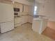 Kitchen with light countertops, matching appliances and tile flooring at 9180 Sw 202Nd Avenue Road, Dunnellon, FL 34431