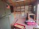 Shed interior showing wooden frame, storage, and shelving at 9180 Sw 202Nd Avenue Road, Dunnellon, FL 34431