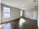 A bright bedroom features tile floors, neutral walls, and natural light from two windows at 4062 Sw 114Th St, Ocala, FL 34476