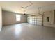 Spacious two-car garage with durable epoxy flooring and automatic door at 4062 Sw 114Th St, Ocala, FL 34476