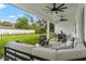 Covered patio with comfortable seating and a dining area at 925 Se 13Th St, Ocala, FL 34471