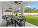 Outdoor dining area on covered patio with ceiling fans at 925 Se 13Th St, Ocala, FL 34471