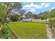 Large backyard with lush green lawn at 925 Se 13Th St, Ocala, FL 34471