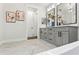 Bright bathroom with double vanity, marble countertops and modern fixtures at 925 Se 13Th St, Ocala, FL 34471