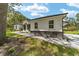 Modern house exterior with stone accents and landscaped yard at 925 Se 13Th St, Ocala, FL 34471