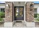 Elegant front entrance with double doors and stone pillars at 925 Se 13Th St, Ocala, FL 34471