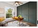 Bright home office features wood desk, window, and green accent wall at 925 Se 13Th St, Ocala, FL 34471