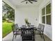 Covered patio with seating for dining al fresco at 925 Se 13Th St, Ocala, FL 34471