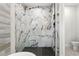 Stunning marble shower with glass enclosure and modern fixtures at 925 Se 13Th St, Ocala, FL 34471