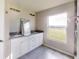 Modern bathroom with double vanity and large window at 5348 Se 91St Pl, Ocala, FL 34480