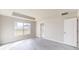 Light-filled bedroom with vinyl flooring and an adjacent bathroom at 5348 Se 91St Pl, Ocala, FL 34480