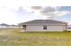 Rear view of a single-story home with covered patio at 5348 Se 91St Pl, Ocala, FL 34480