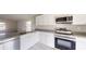 Modern kitchen with stainless steel appliances and an island at 5348 Se 91St Pl, Ocala, FL 34480