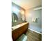 Neutral toned bathroom with vanity sink, modern mirror and a towel rack at 2710 Sw 36Th Dr, Ocala, FL 34474