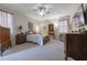 Bedroom with carpeted floors, antique furniture, and a ceiling fan at 4348 Sw Deepwater Ct, Dunnellon, Fl, FL 34431