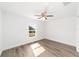 Bright bedroom with wood-look floors, ceiling fan, and window at 14293 Sw 32Nd Pl, Ocala, FL 34481