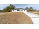 New construction home with gray siding and a large yard at 14293 Sw 32Nd Pl, Ocala, FL 34481