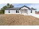 Newly built home with gray siding and a gray roof at 14293 Sw 32Nd Pl, Ocala, FL 34481