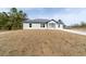 New construction home on a hill with a concrete driveway at 14293 Sw 32Nd Pl, Ocala, FL 34481