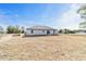 Rear view of a single story house with gray siding at 14293 Sw 32Nd Pl, Ocala, FL 34481