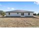 Rear view of a single story house with gray siding at 14293 Sw 32Nd Pl, Ocala, FL 34481