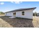 Rear view of a single story house with gray siding at 14293 Sw 32Nd Pl, Ocala, FL 34481