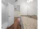 Well-lit bathroom featuring marble tile, modern sink, and shower at 14409 Sw 30Th Pl, Ocala, FL 34481