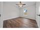 Bedroom with hardwood flooring, ceiling fan, and natural light at 14409 Sw 30Th Pl, Ocala, FL 34481