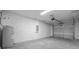 Garage with concrete floors and white block walls at 14409 Sw 30Th Pl, Ocala, FL 34481